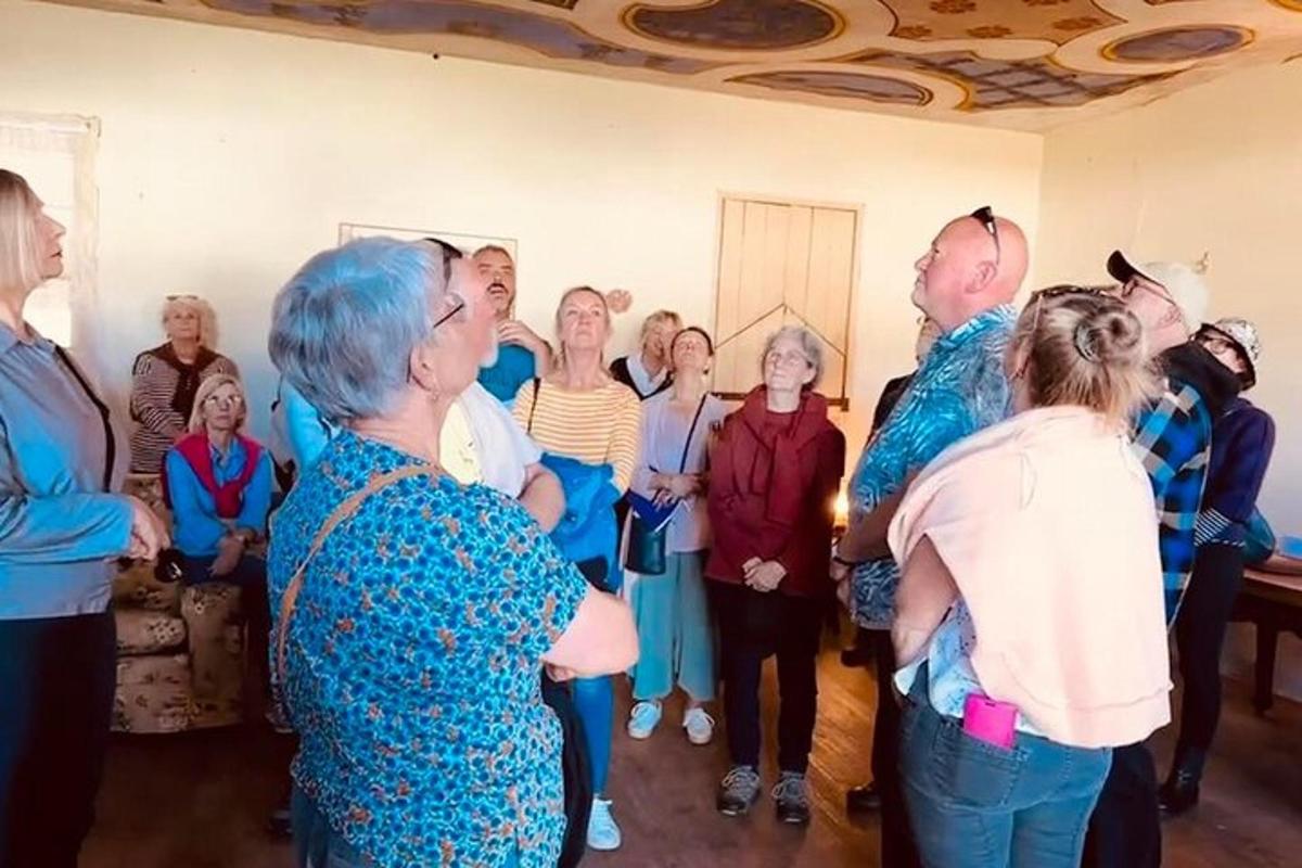 a group of older people standing in a room