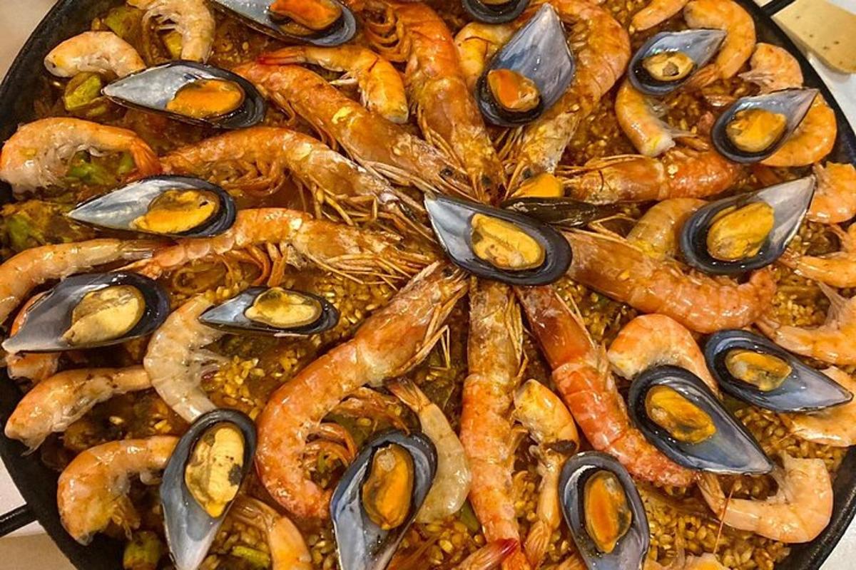 a pan filled with shrimp and other seafood foods
