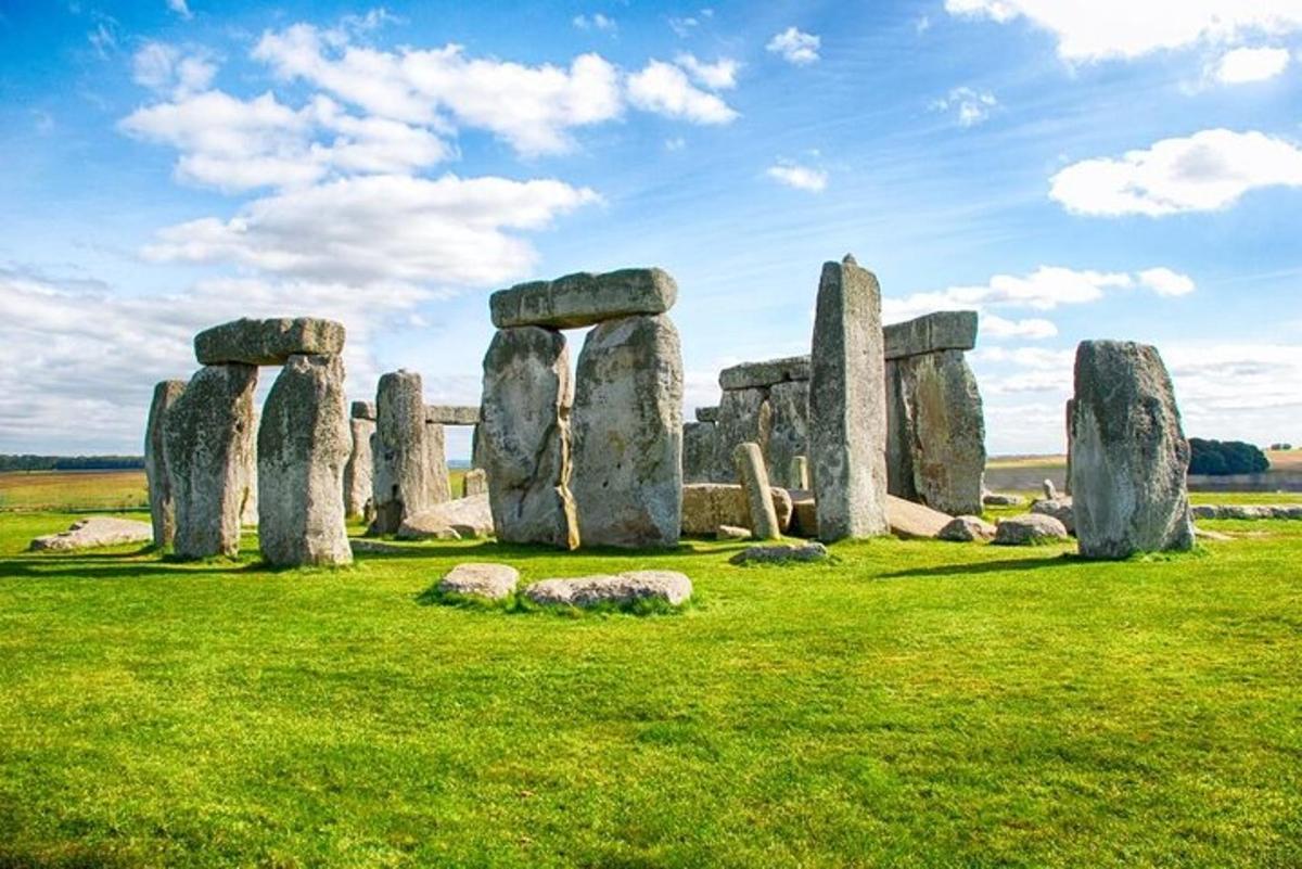 a group of stonehenge stones in a field