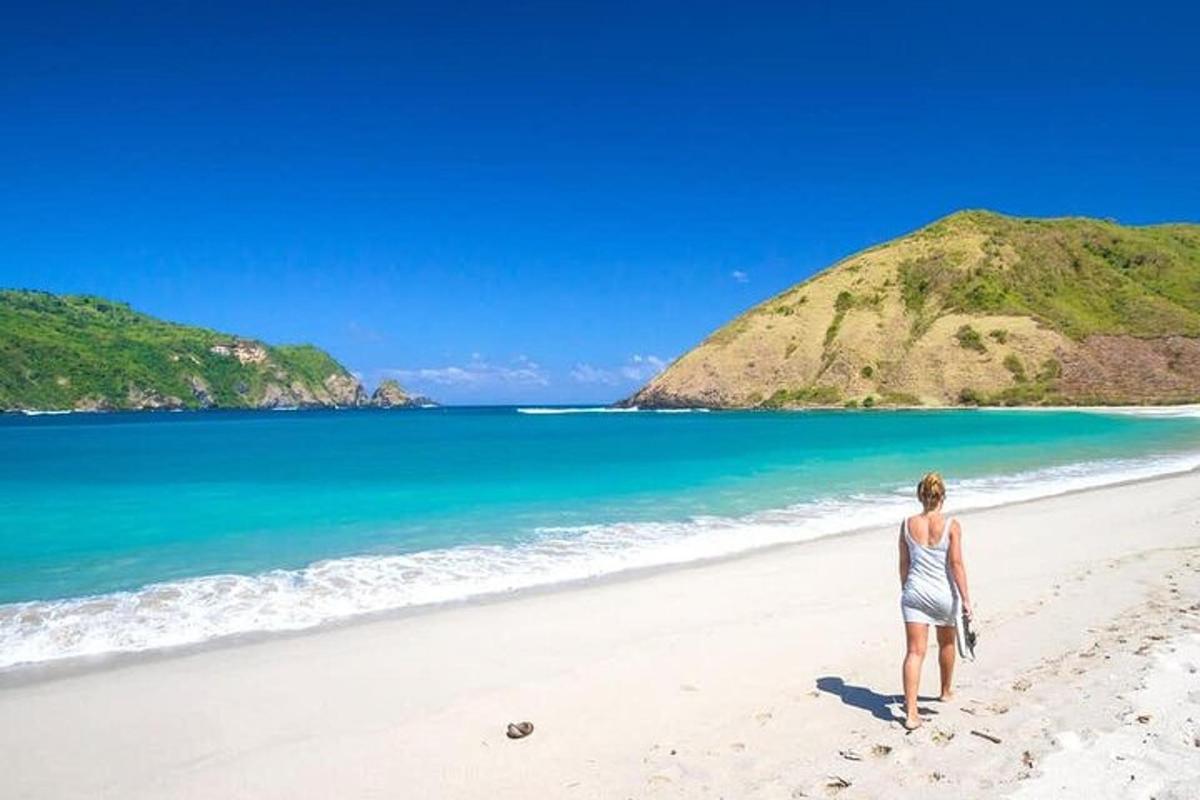 a woman walking on the beach
