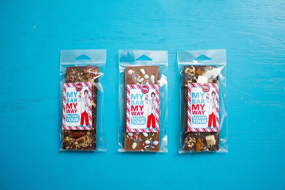 three packets of marshmallows and peanuts on a blue table