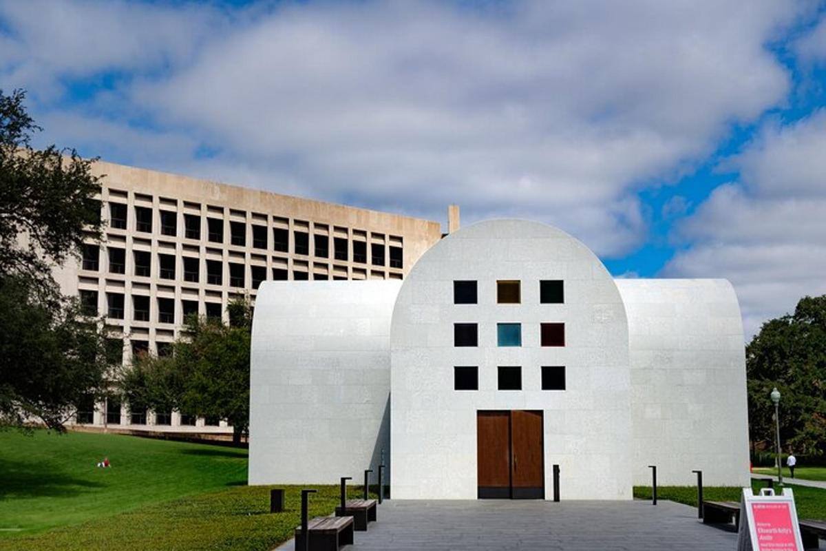 a white building with a door in front of a building