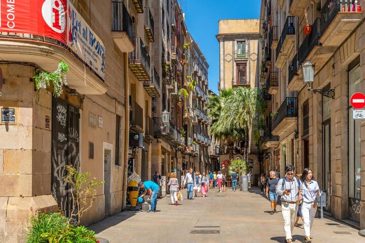 a group of people walking down a street with buildings
