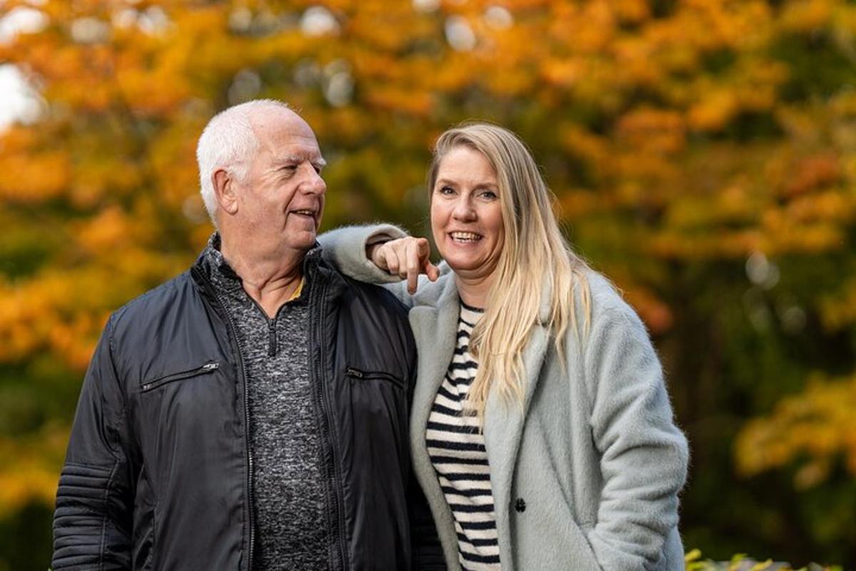 an older man and a woman walking together