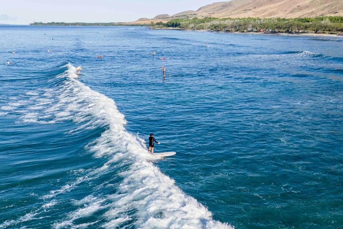 a person riding a wave on a surfboard in the water