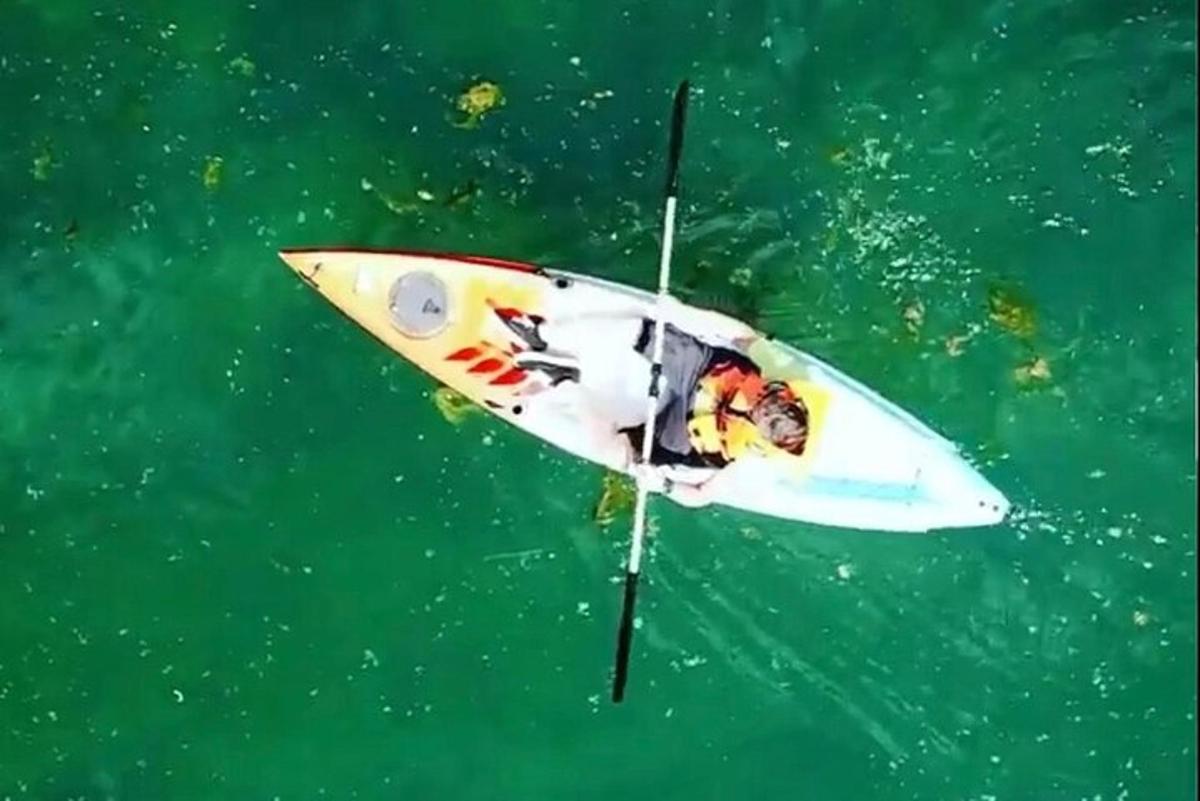 a surfboard floating in the water in the ocean