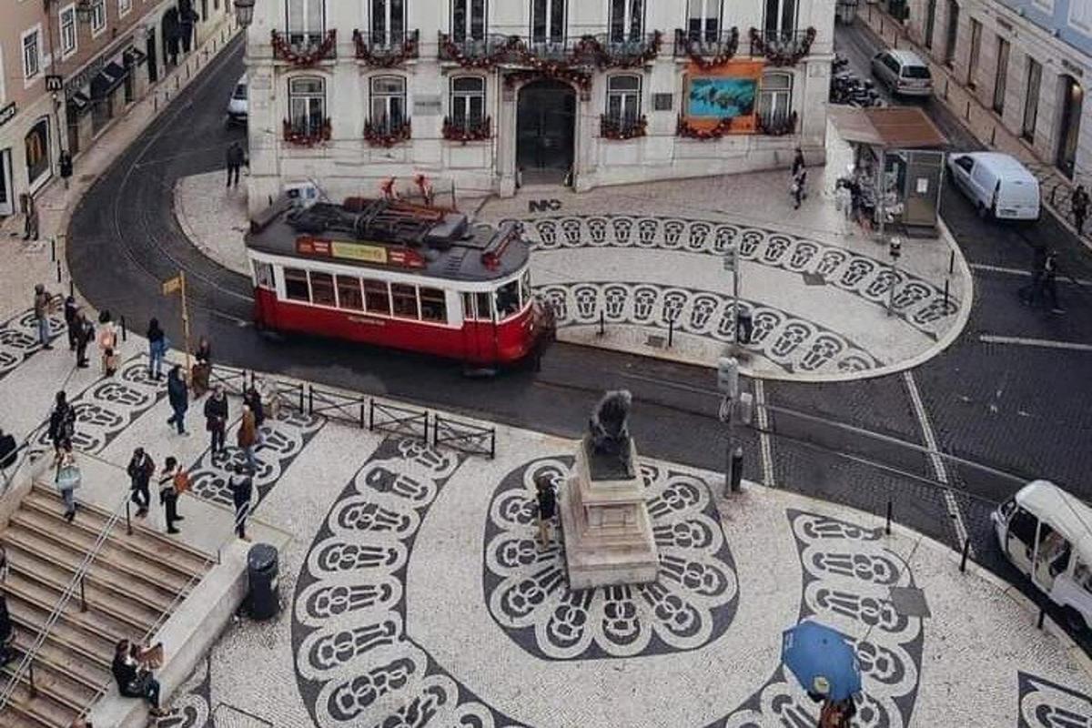 a red and white bus on a city street