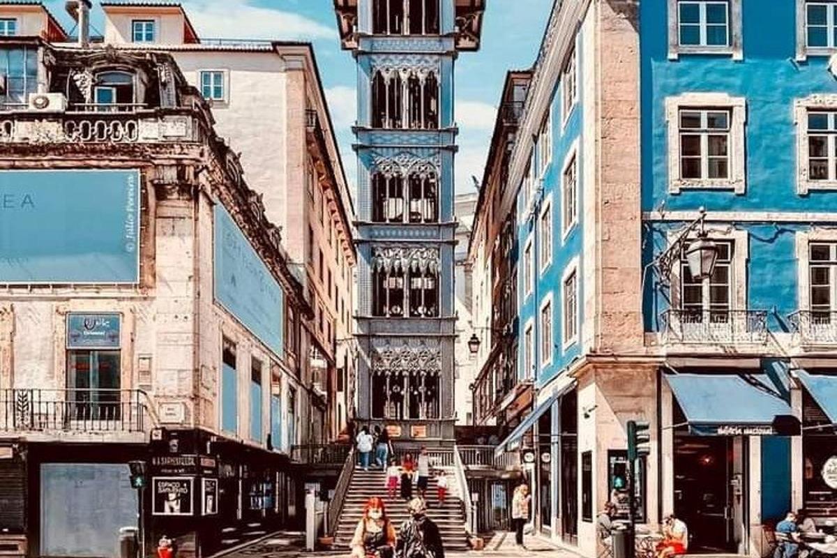 a city street with buildings and a clock tower