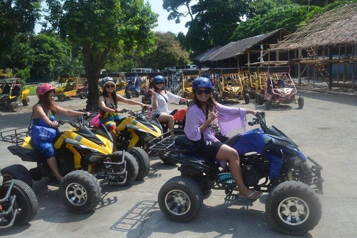 a group of people riding atvs on a road