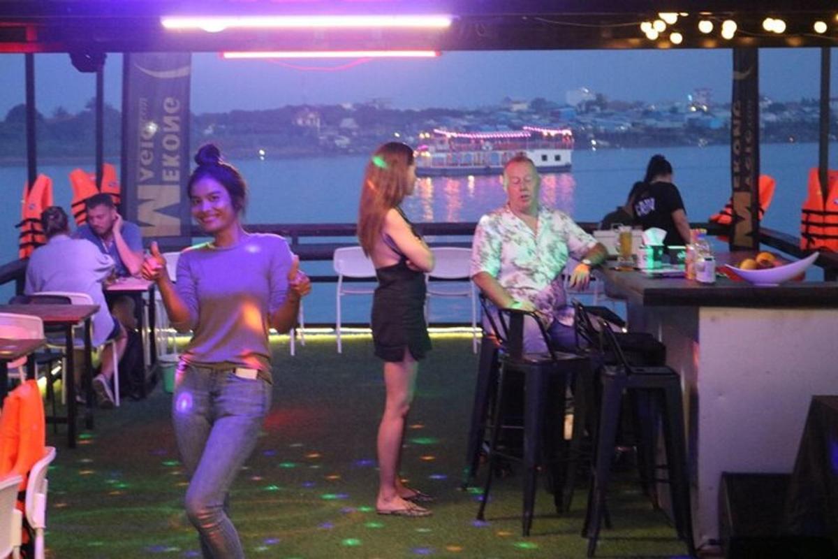 a group of people standing in a bar