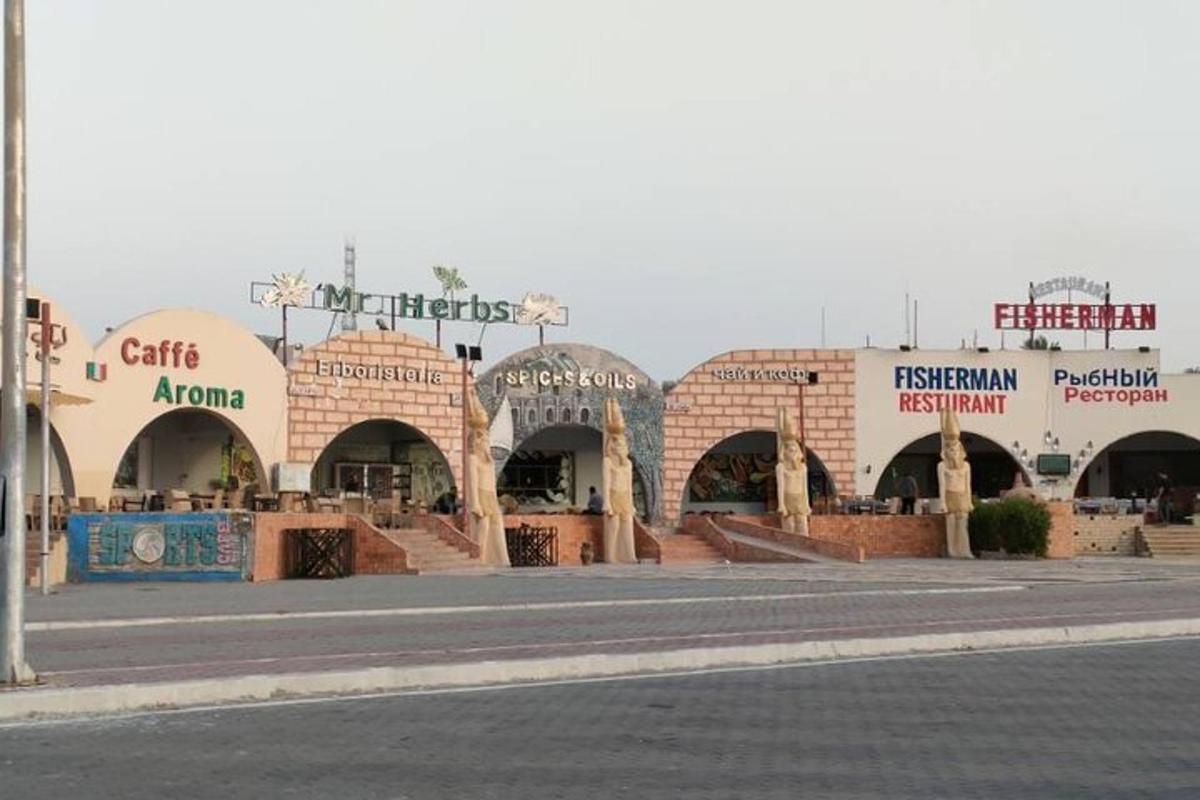 an empty street in front of a shopping center