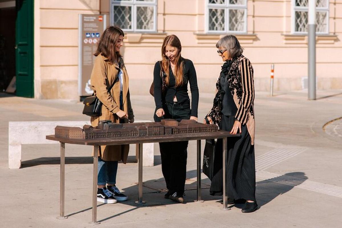 two women standing next to a table with a keyboard