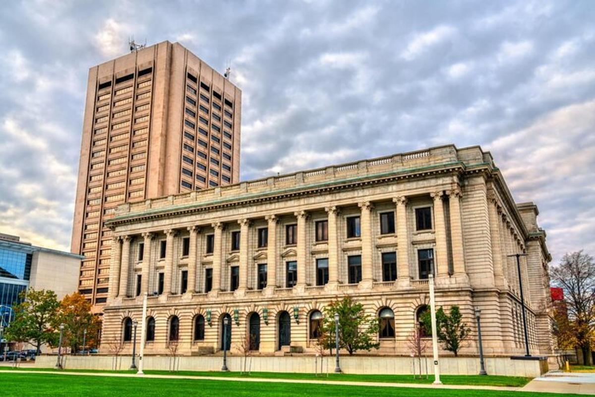 a large building with a tall building in the background