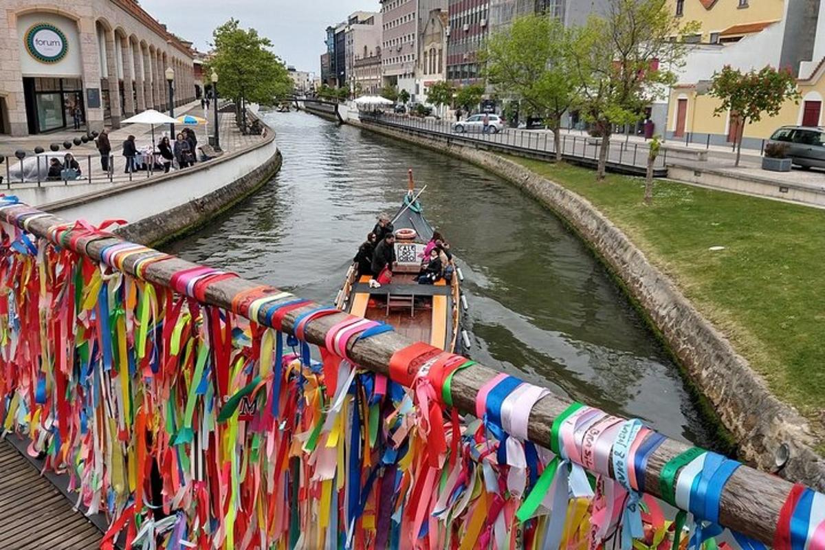 a boat on a river with colorful ribbons on a railing