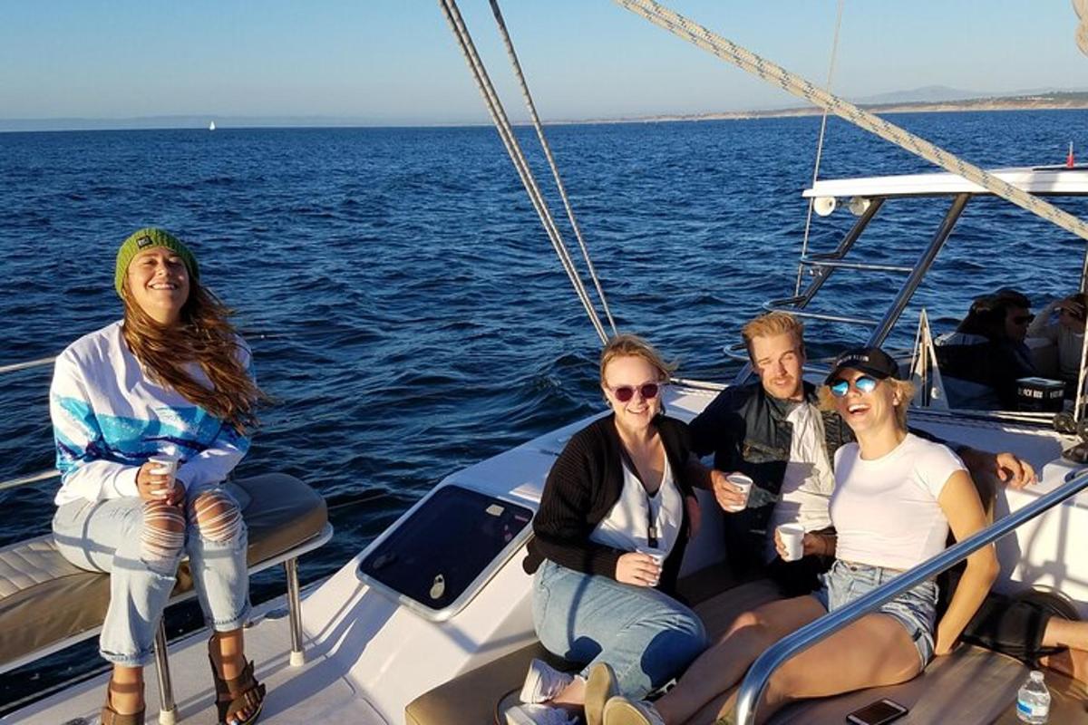a group of people sitting on a boat in the water