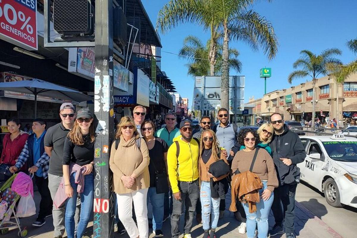 a group of people posing for a picture on a street