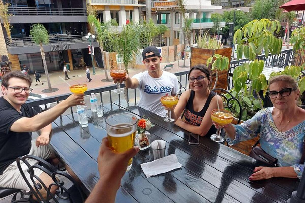 a group of people sitting at a table with drinks