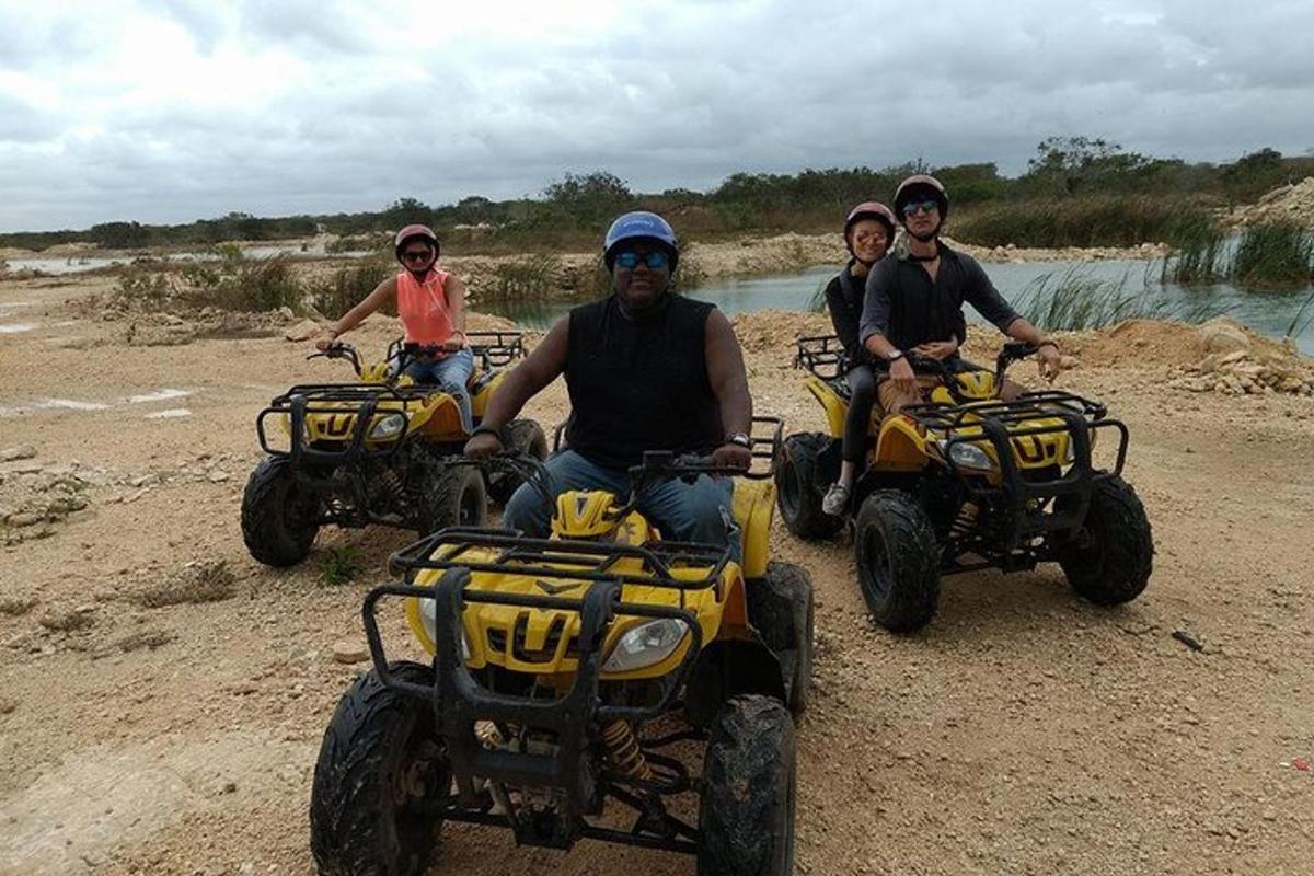 a group of people riding atvs on a beach
