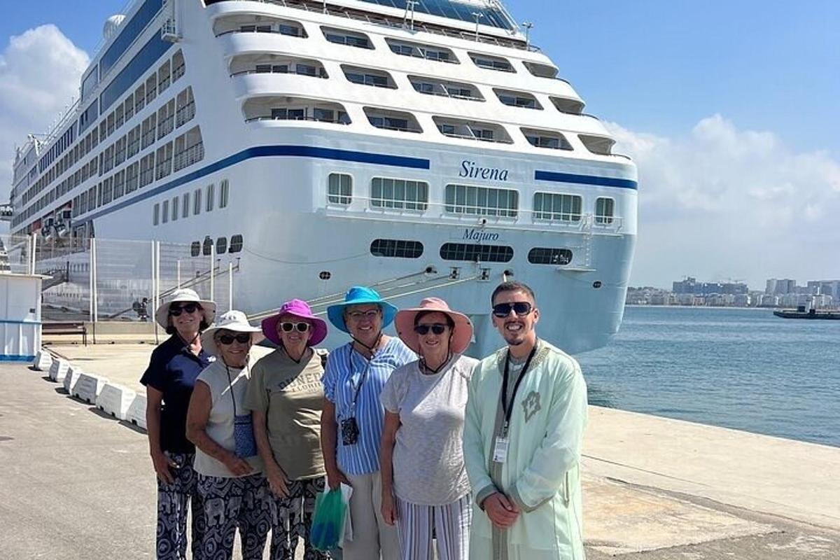 a group of people standing in front of a cruise ship