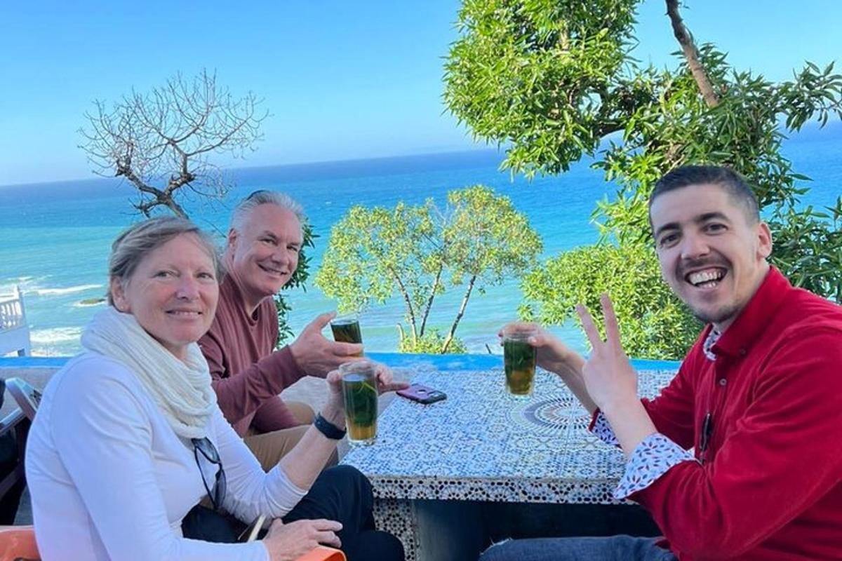 a group of people sitting at a table with drinks