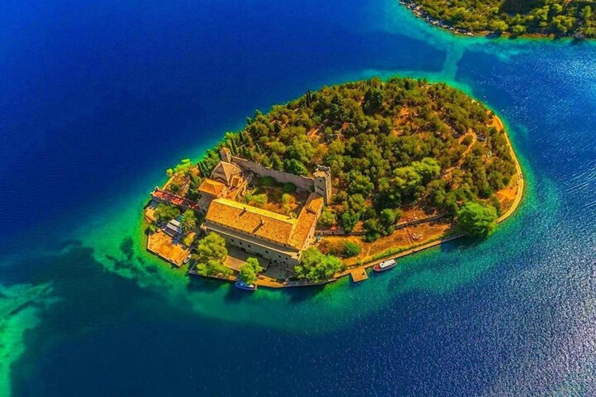 an island in the water with a building on it