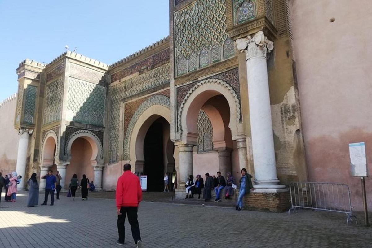 a group of people standing outside of a building
