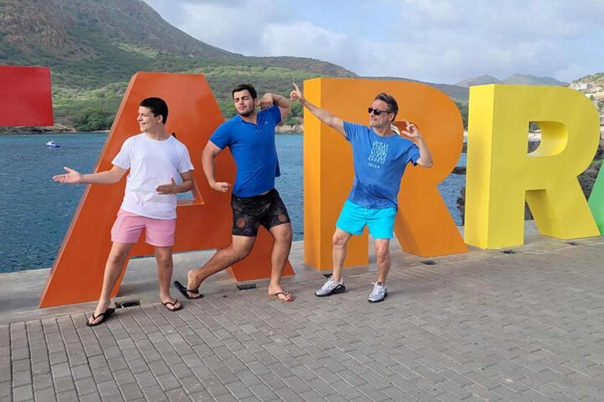 three men standing in front of a large php sign