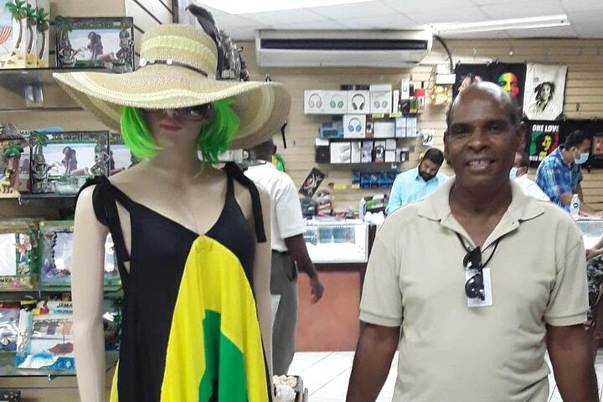 a man standing next to a mannequin in a store
