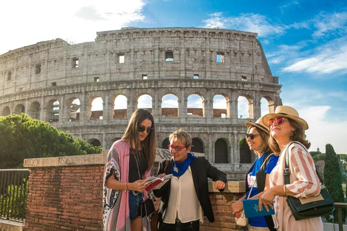 a group of women standing in front of the coliseum