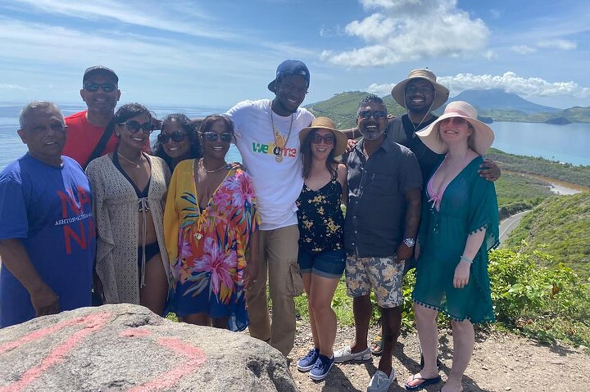 a group of people posing for a picture on a mountain