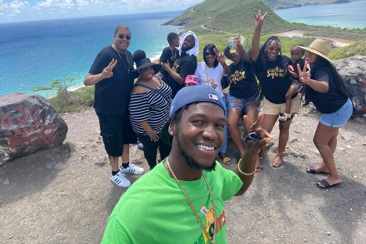 a group of people standing on top of a mountain