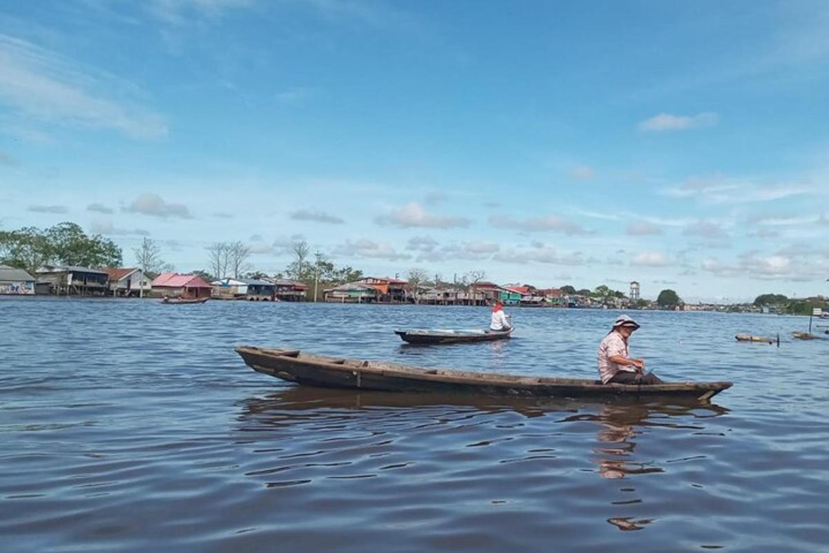 two people in a boat on a body of water