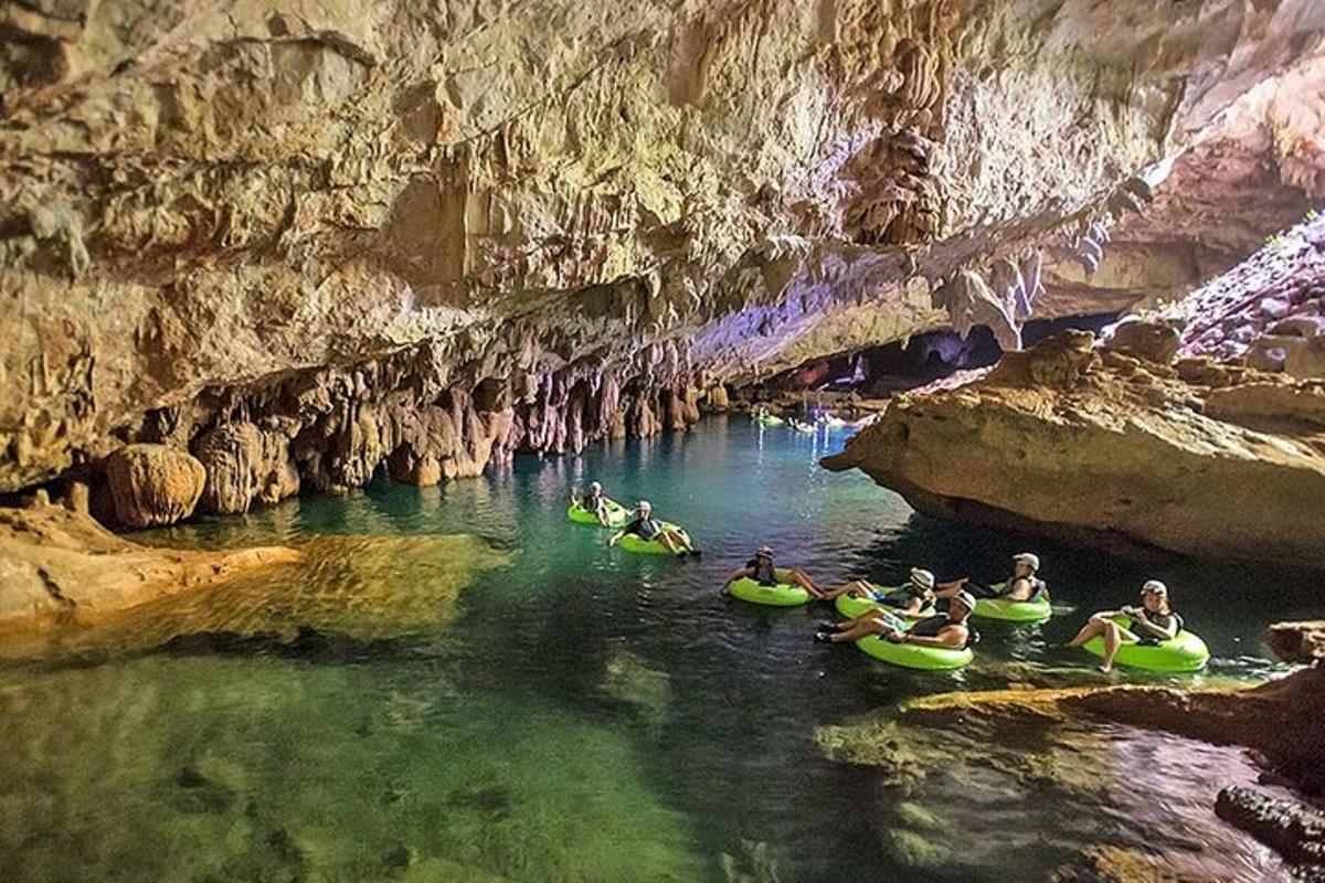 a group of people in kayaks in a cave