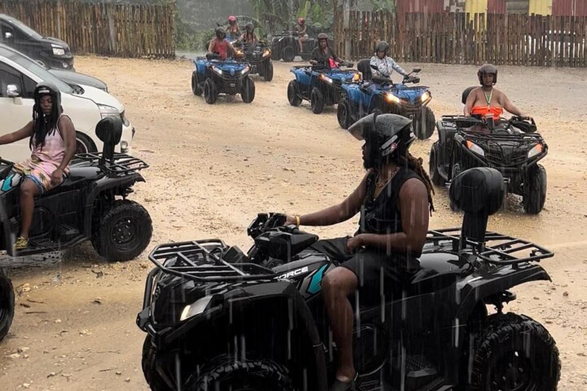 a group of people riding atvs on a dirt road