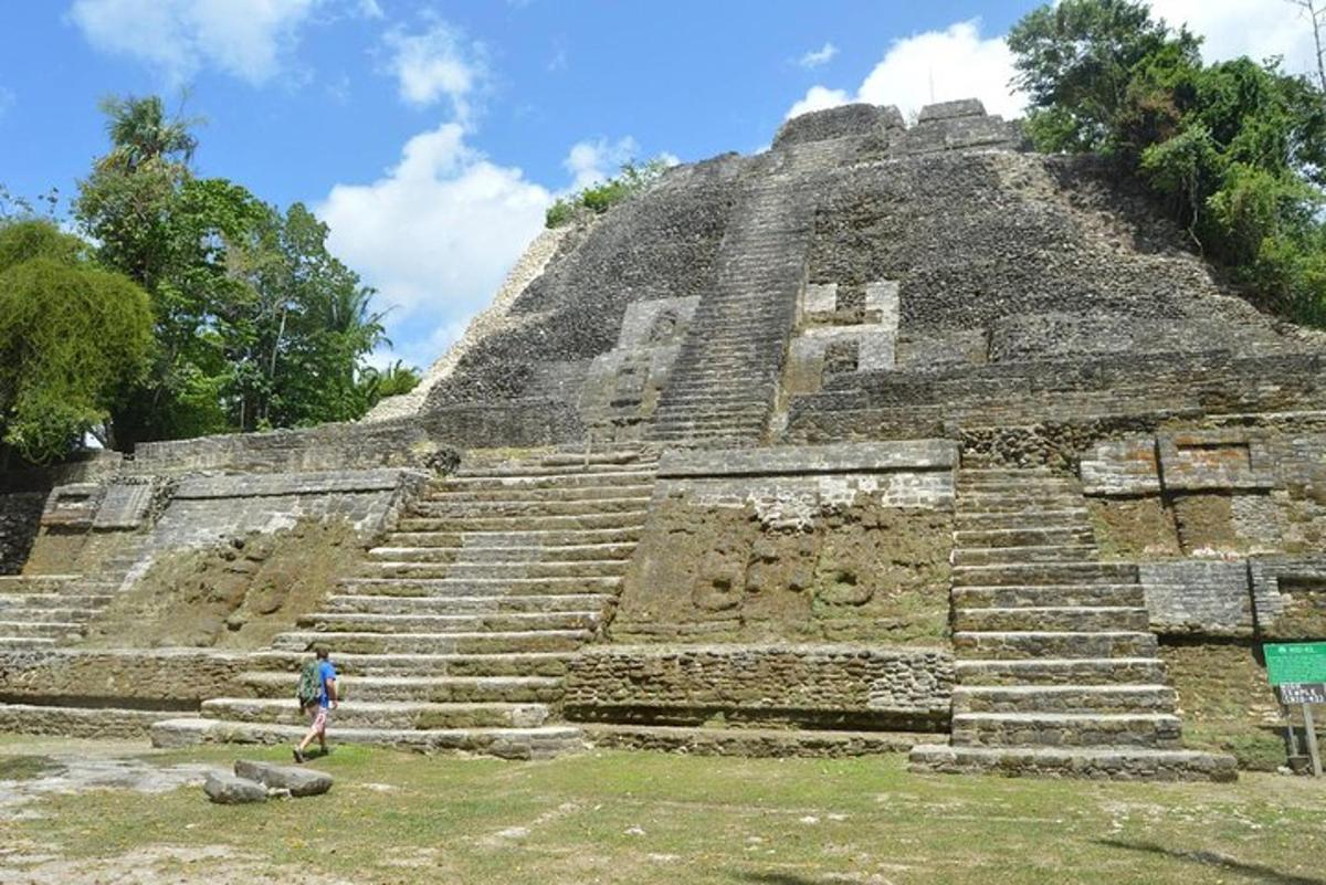 a person standing in front of an pyramid