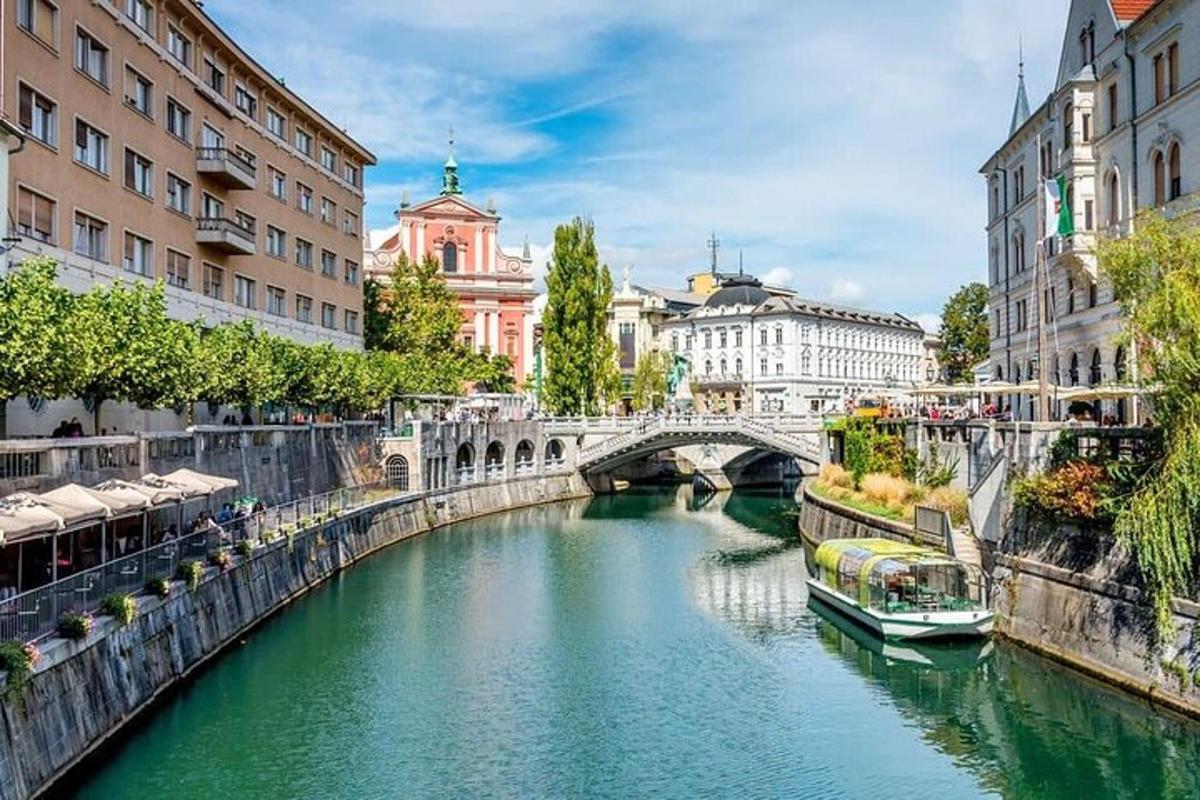 a river in a city with a bridge and a boat