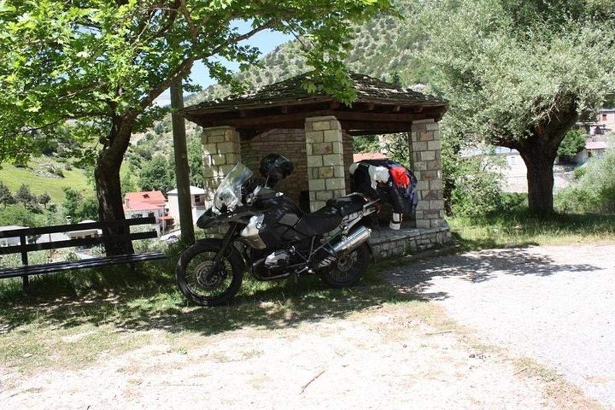 a motorcycle parked in front of a brick building