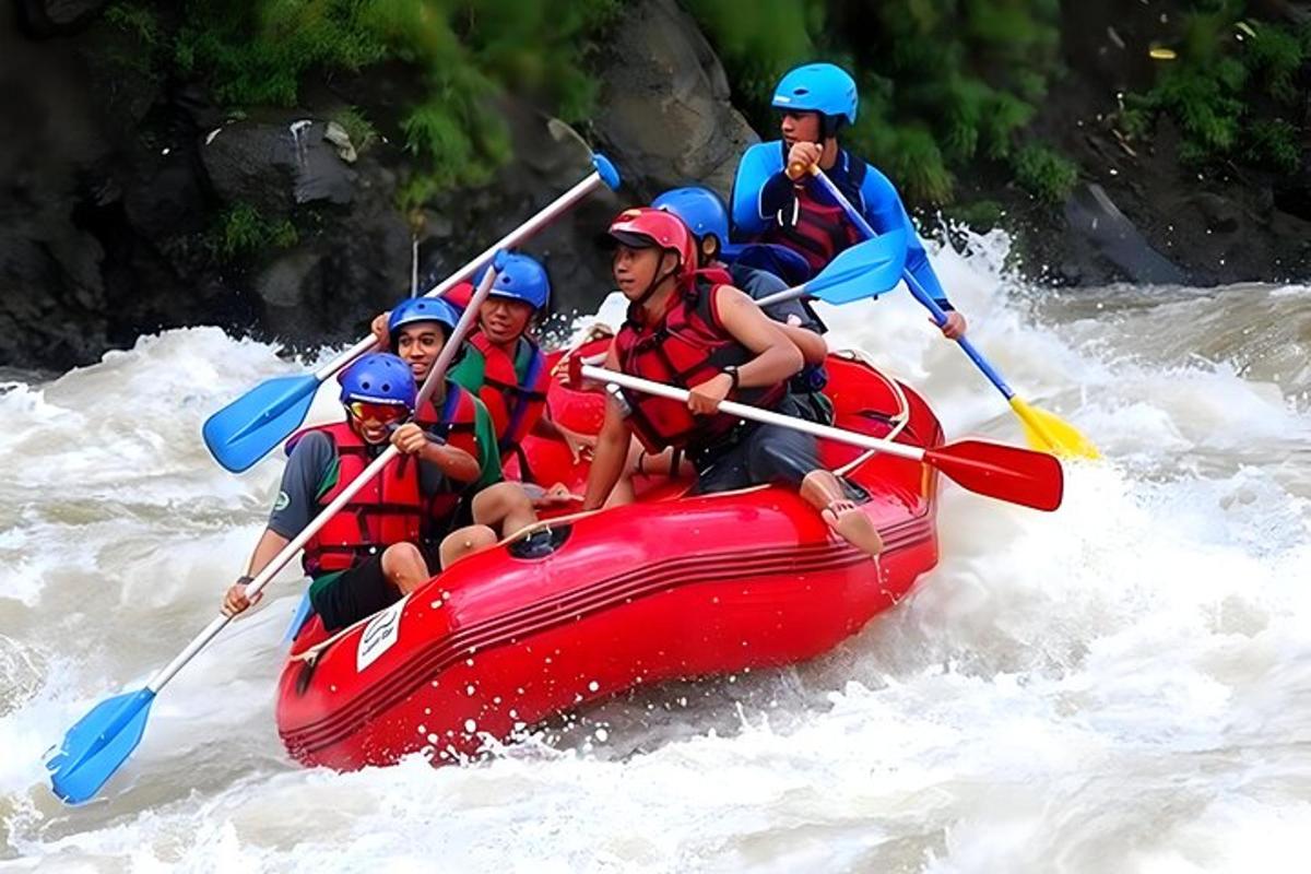 a group of people in a raft in the water