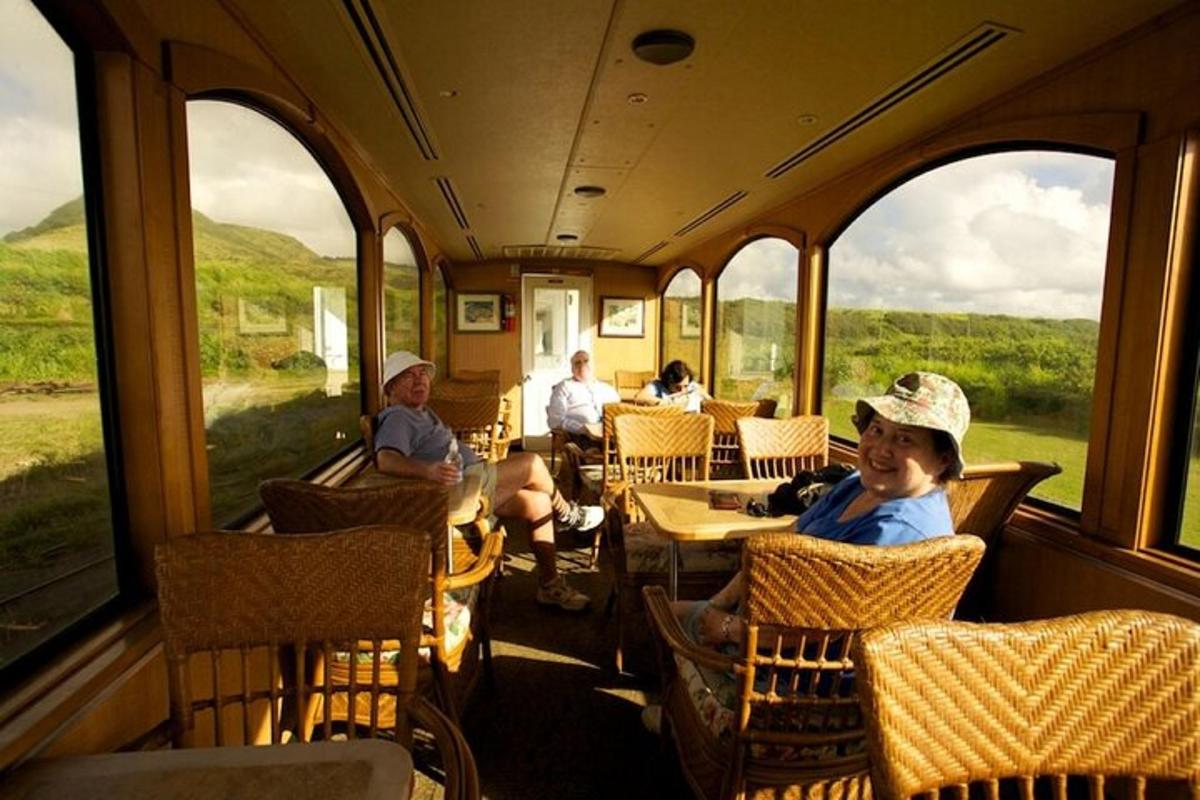 a group of people sitting on a train looking out the windows