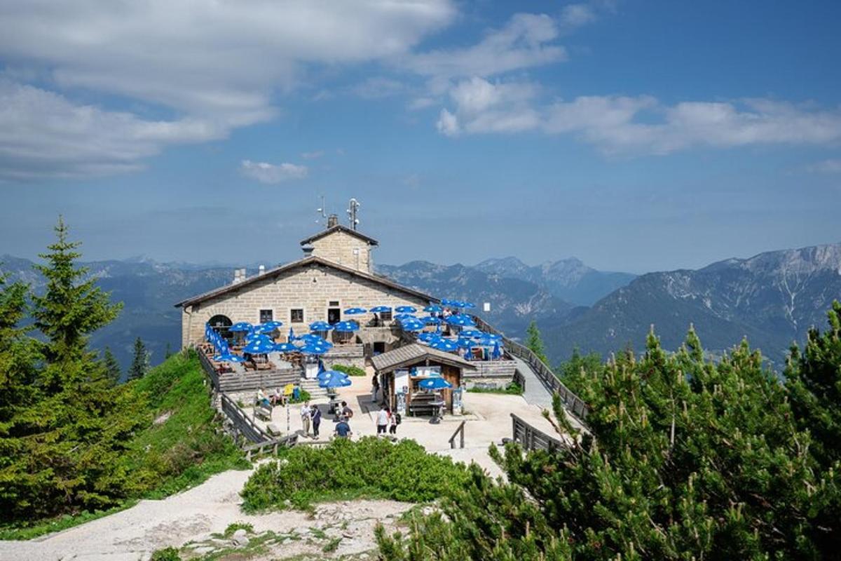 a building on top of a mountain with people on it
