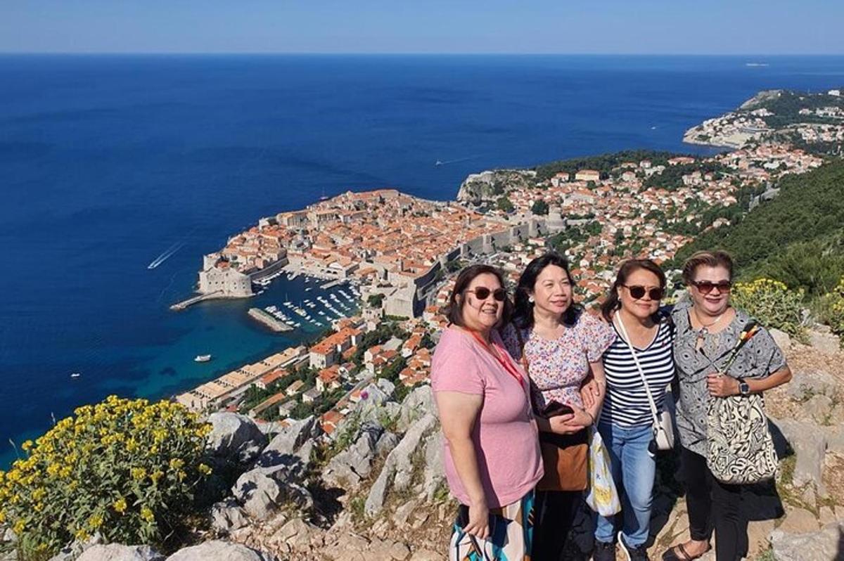 a group of people standing on top of a mountain