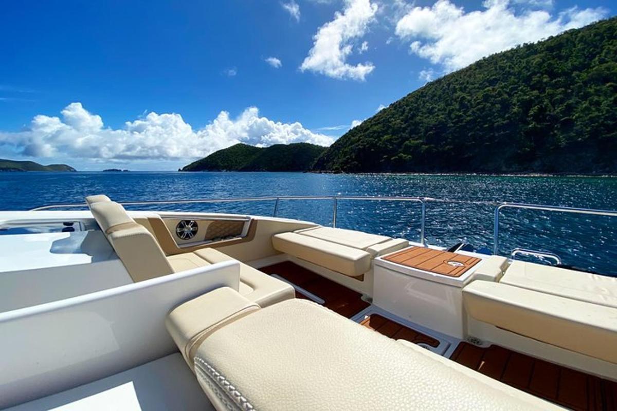 a boat with seats on a body of water