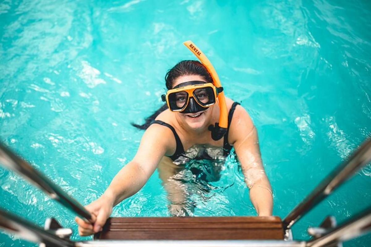 a woman in a swimming pool wearing a snorkel