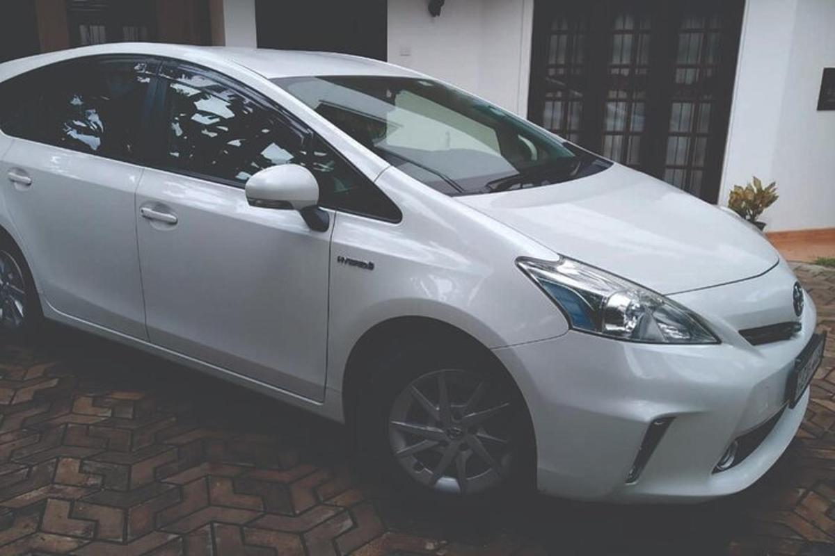 a white car parked on a brick road