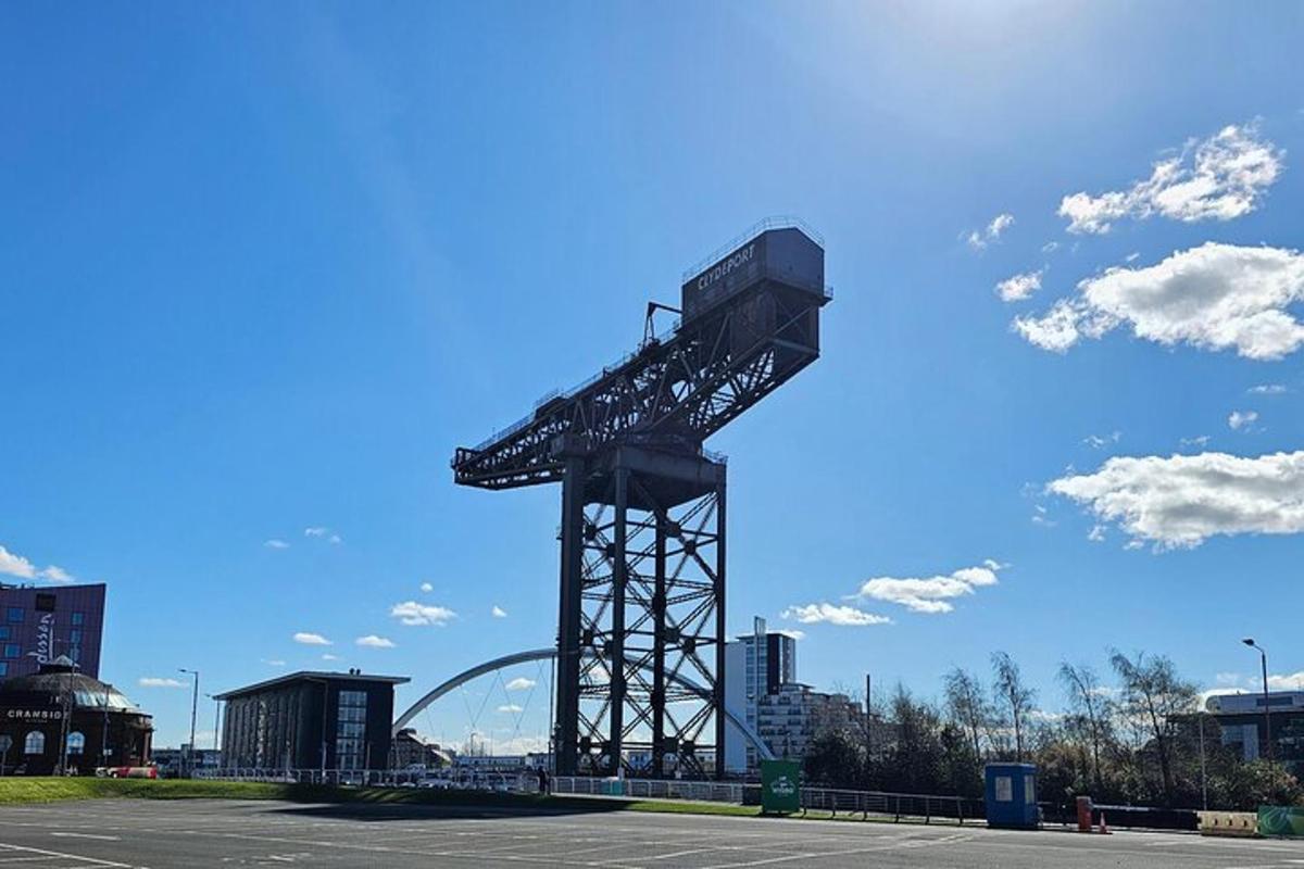 a large metal structure in a parking lot