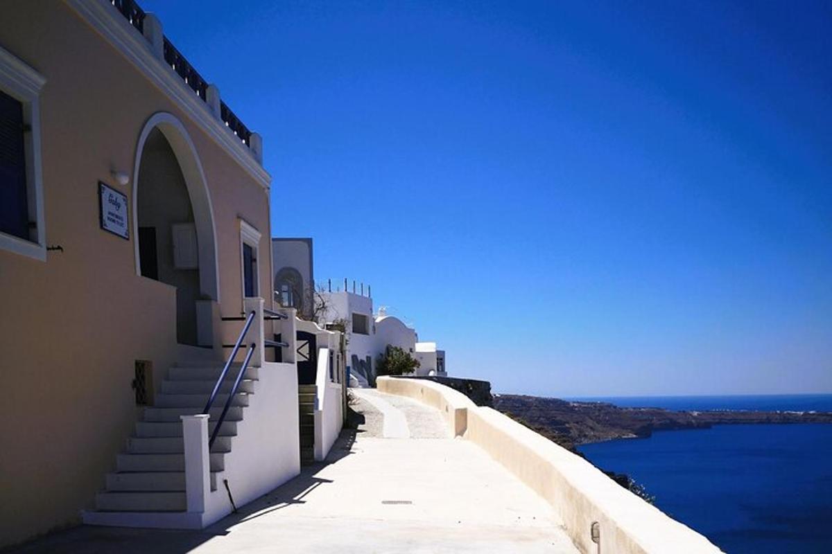 a building with stairs leading down to the water