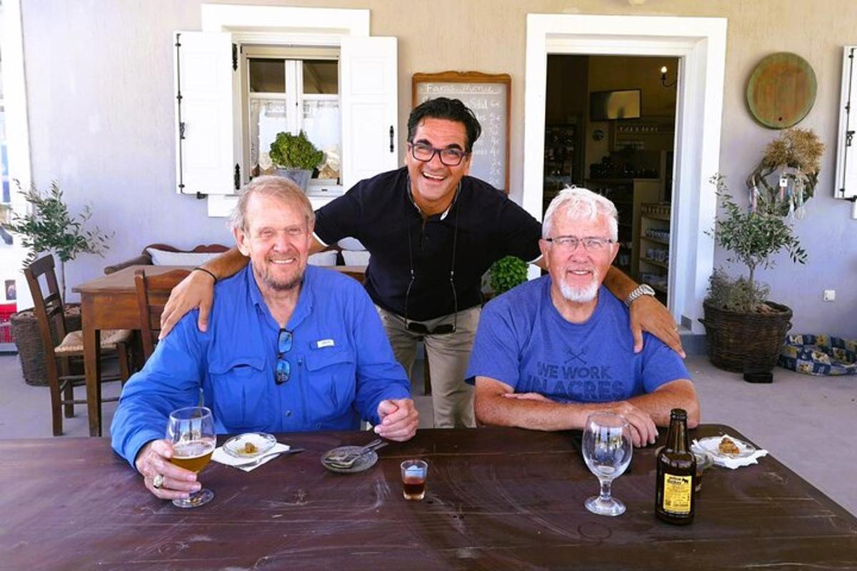 a group of three men sitting at a table
