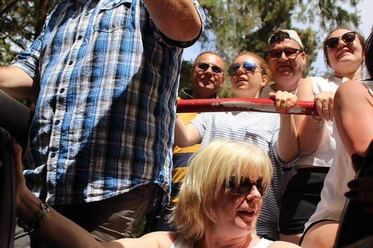 a group of people standing around a man holding a hoop