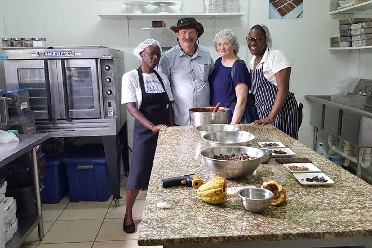 a group of people standing in a kitchen