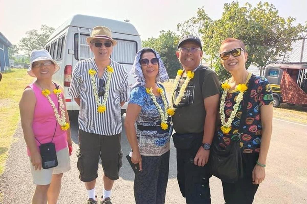 a group of people standing in front of a rv